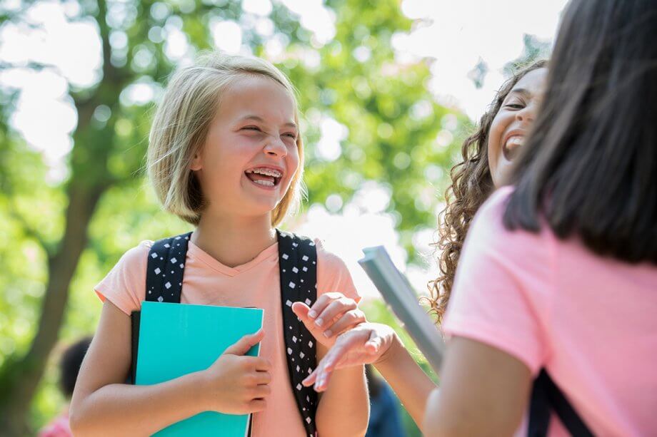 laughing children in braces